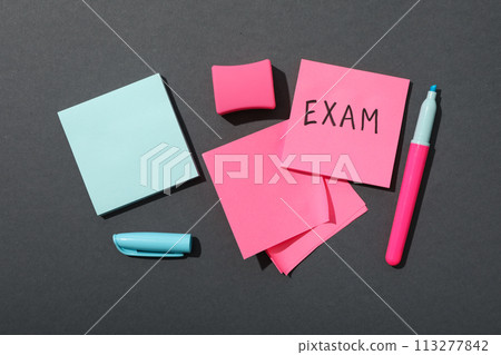 Exam, writing on a piece of paper. Exam, writing on a piece of paper. 113277842