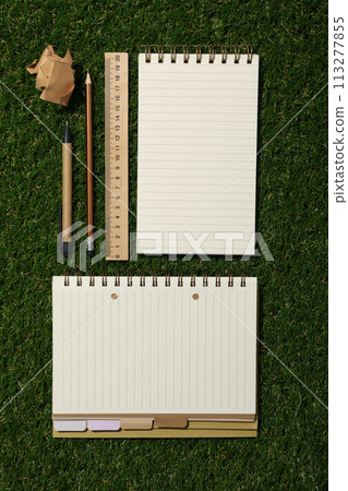 Notebook and stationery on the table, top view. 113277855