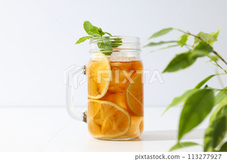A glass of delicious cold tea on a white background 113277927