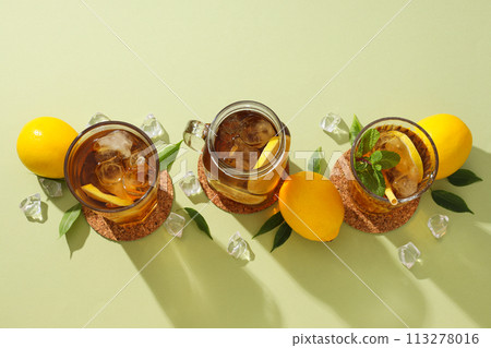 Cold tea with ice, mint leaves and orange slices 113278016