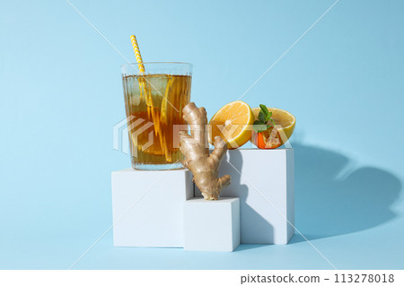 A glass of cold tea on a blue background 113278018