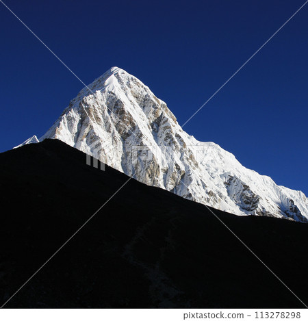 Majestic Mount Pumori after new snowfall, view from Gorakshep, Nepal. 113278298