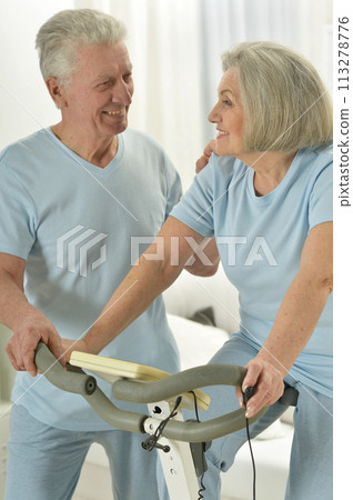 Portrait of happy sporty senior couple exercising 113278776