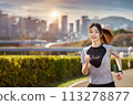 A woman in her 20s jogging in the evening after work 113278877