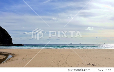 A lonely beach and blue sky waiting for the short summer 113279466