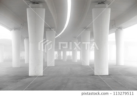 A large, empty parking lot with a foggy atmosphere A large, empty parking lot with a foggy atmosphere 113279511