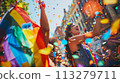 Joyful Pride Celebration with Rainbow Flag and Confetti 113279711