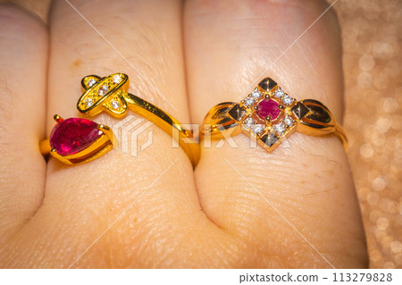 Gold ring with ruby 113279828