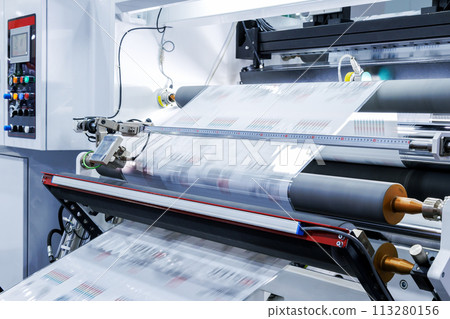 new innovative technology of automatic label printing machine with digital control panel. printing on continuous plastic film for wrapping on food product packaging in the printing factory. 113280156