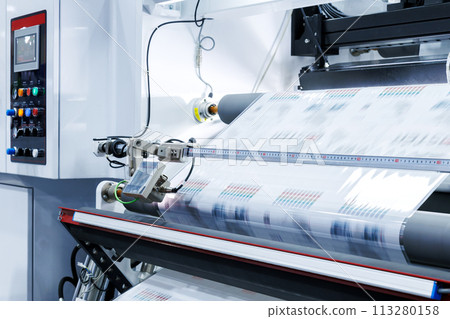 new innovative technology of automatic label printing machine with digital control panel. printing on continuous plastic film for wrapping on food product packaging in the printing factory. 113280158