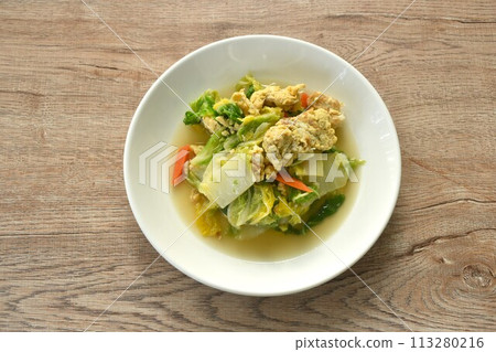 fried white Chinese cabbage with egg in soy sauce on plate fried white Chinese cabbage with egg in soy sauce on plate 113280216