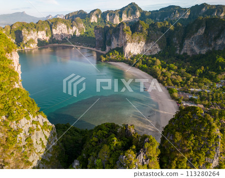 An aerial view of a Railay beach of water surrounded by mountains 113280264