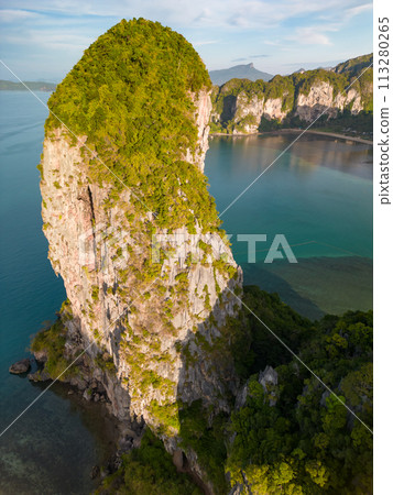 An aerial view of a Railay beach of water surrounded by mountains An aerial view of a Railay beach of water surrounded by mountains 113280265