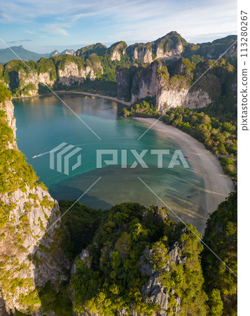 An aerial view of a Railay beach of water surrounded by mountains An aerial view of a Railay beach of water surrounded by mountains 113280267