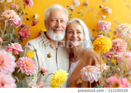 Cherish timeless love with this heartwarming photo of an elderly couple smiling among vibrant flowers Cherish timeless love with this heartwarming photo of an elderly couple smiling among vibrant flowers 113280326