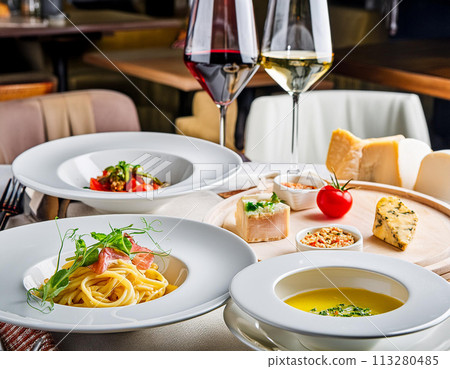Food and wine on a restaurant table, Italian 113280485