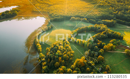 Aerial View Of Green Forest And Meadow Hill Landscape Near River. Top View Of Beautiful Nature From High Attitude. 113280535