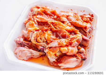 Chicken wings marinated in sweet and spicy sauce 113280691