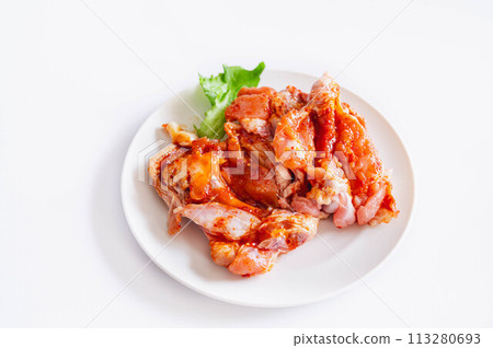 Chicken wings marinated in sweet and spicy sauce 113280693
