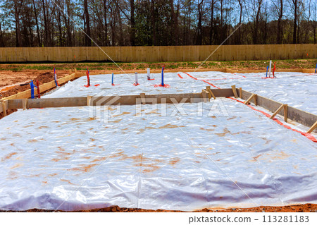During construction of house, ground is covered with waterproofing layer before foundation is poured During construction of house, ground is covered with waterproofing layer before foundation is poured 113281183