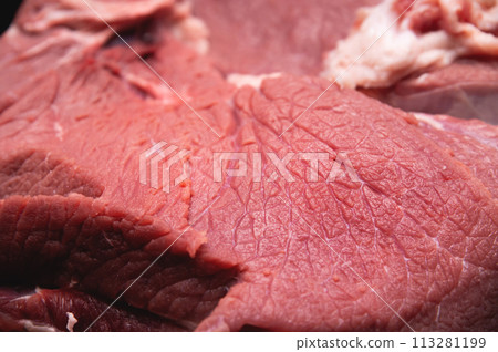 Close-up of a piece of fresh beef meat in shallow depth of field 113281199
