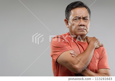Middle aged Asian grasping shoulder in pain, signs of frozen shoulder Middle aged Asian grasping shoulder in pain, signs of frozen shoulder 113281683