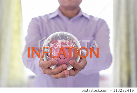 A Businessman holding a pink piggy bank in severe inflation situations around the world. Concept, finance, banking, interest rates, economy. Selective focus, Closeup, Blurred background A Businessman holding a pink piggy bank in severe inflation situations around the world. Concept, finance, banking, interest rates, economy. Selective focus, Closeup, Blurred background 113282419