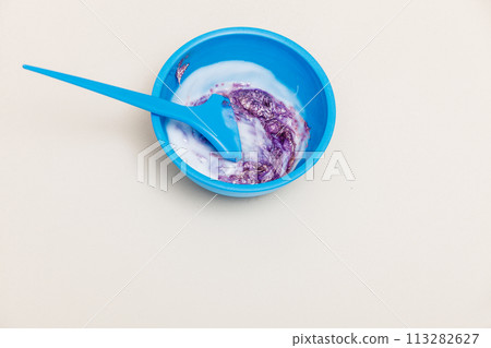 Two plastic bowls with bleach hair dye 113282627