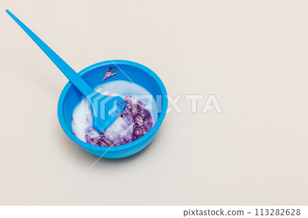Two plastic bowls with bleach hair dye 113282628