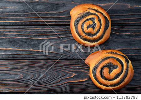 Homemade bun with poppy seeds Homemade bun with poppy seeds 113282788
