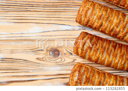 Golden Puff pastry stuffed with sausage and cheese 113282855