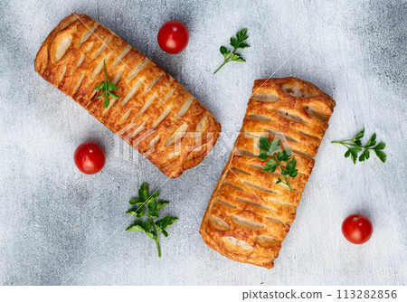 Golden Puff pastry stuffed with sausage and cheese 113282856