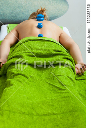 Massage with cupping glass in beautician Massage with cupping glass in beautician 113282886