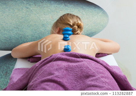 Massage with cupping glass in beautician Massage with cupping glass in beautician 113282887