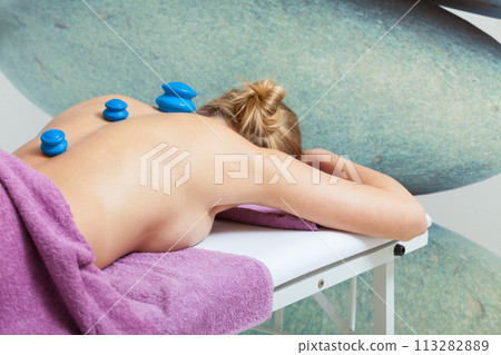 Massage with cupping glass in beautician Massage with cupping glass in beautician 113282889