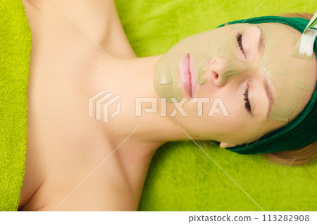 Woman having algae mud mask on face 113282908