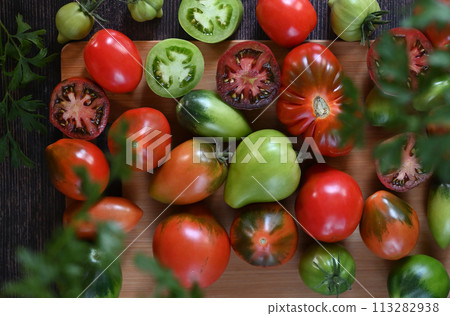 Fresh sliced tomatoes on black background, copy space Fresh sliced tomatoes on black background, copy space 113282938