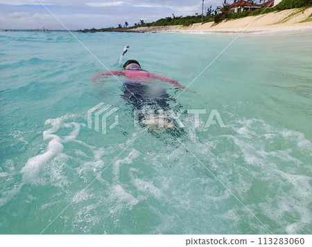 A woman snorkeling in the beautiful sea of Miyakojima, Okinawa 113283060