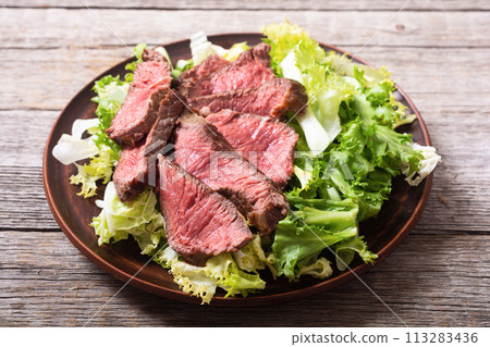Salad with grilled beef medium roast Salad with grilled beef medium roast 113283436
