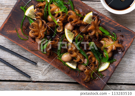Baby octopus fried with lemon Baby octopus fried with lemon 113283510