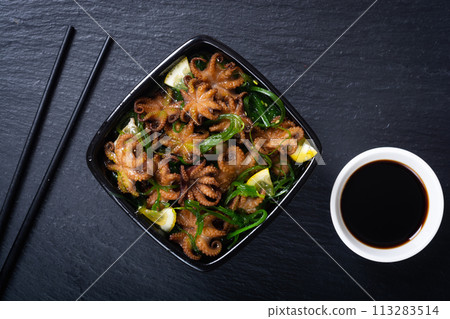 Baby octopus fried with lemon Baby octopus fried with lemon 113283514