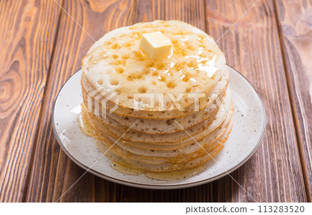 Moroccan traditional eating . Pancakes with honey Moroccan traditional eating . Pancakes with honey 113283520