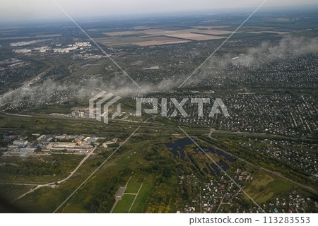 View from the plane when landing on an industrial city View from the plane when landing on an industrial city 113283553