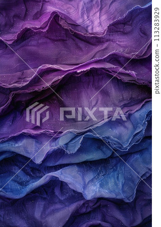 Close-up of vibrant purple and blue fabric folds creating a wavelike abstract texture 113283929