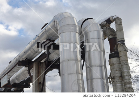 The main provides the city with hot water. Selective focus. The large pipes  113284204