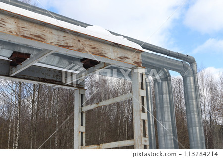 The main provides the city with hot water. Selective focus. The large pipes  113284214