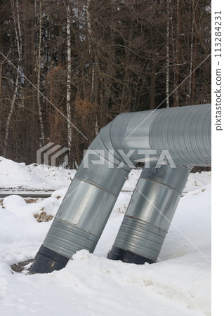 The main provides the city with hot water. Selective focus. The large pipes The main provides the city with hot water. Selective focus. The large pipes 113284231