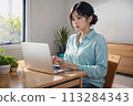 Female remote worker in her 20s Light blue blouse 113284343