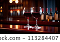 Two red wine glass and collection of wines on the background in the wine bar 113284407