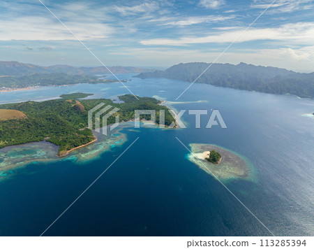 Drone view of Island with turquoise water and coral reefs. Lajala, Coron. Palawan. Philippines. Drone view of Island with turquoise water and coral reefs. Lajala, Coron. Palawan. Philippines. 113285394